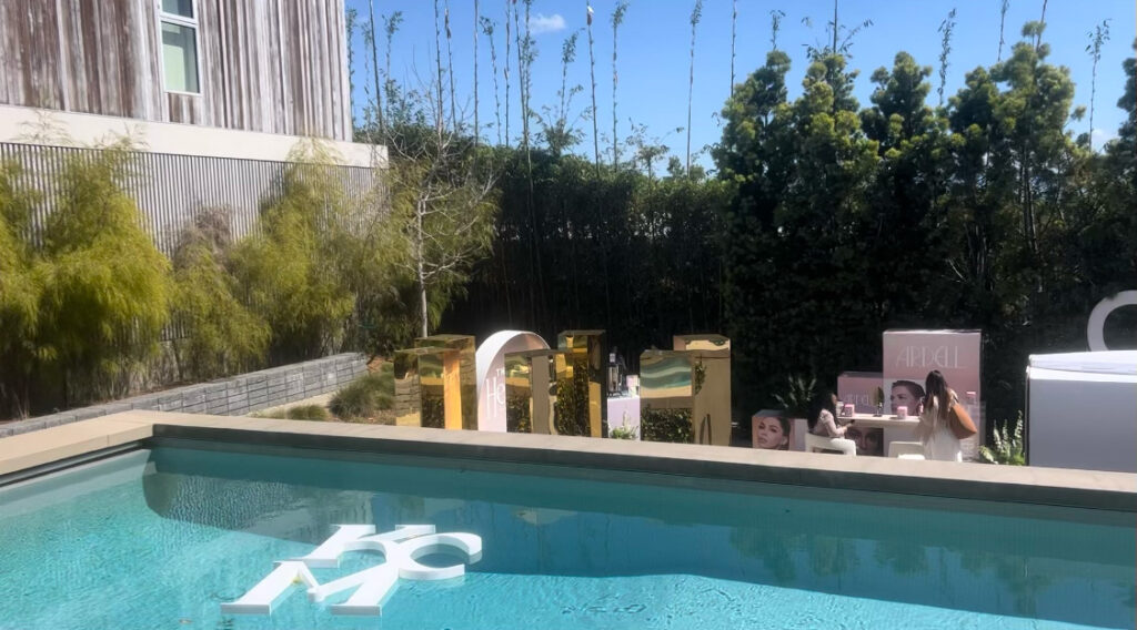 Poolside view with KCM logo inside of pool at KCM Headliners