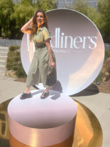 Woman at entrance of KCM Headliners Gifting Suite
