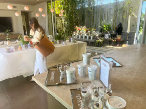 Woman passing by Cocojune yogurt display at KCM Headliners