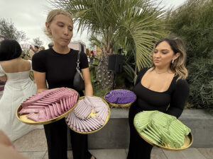 Two ladies passing out samples of Revive Collagen products