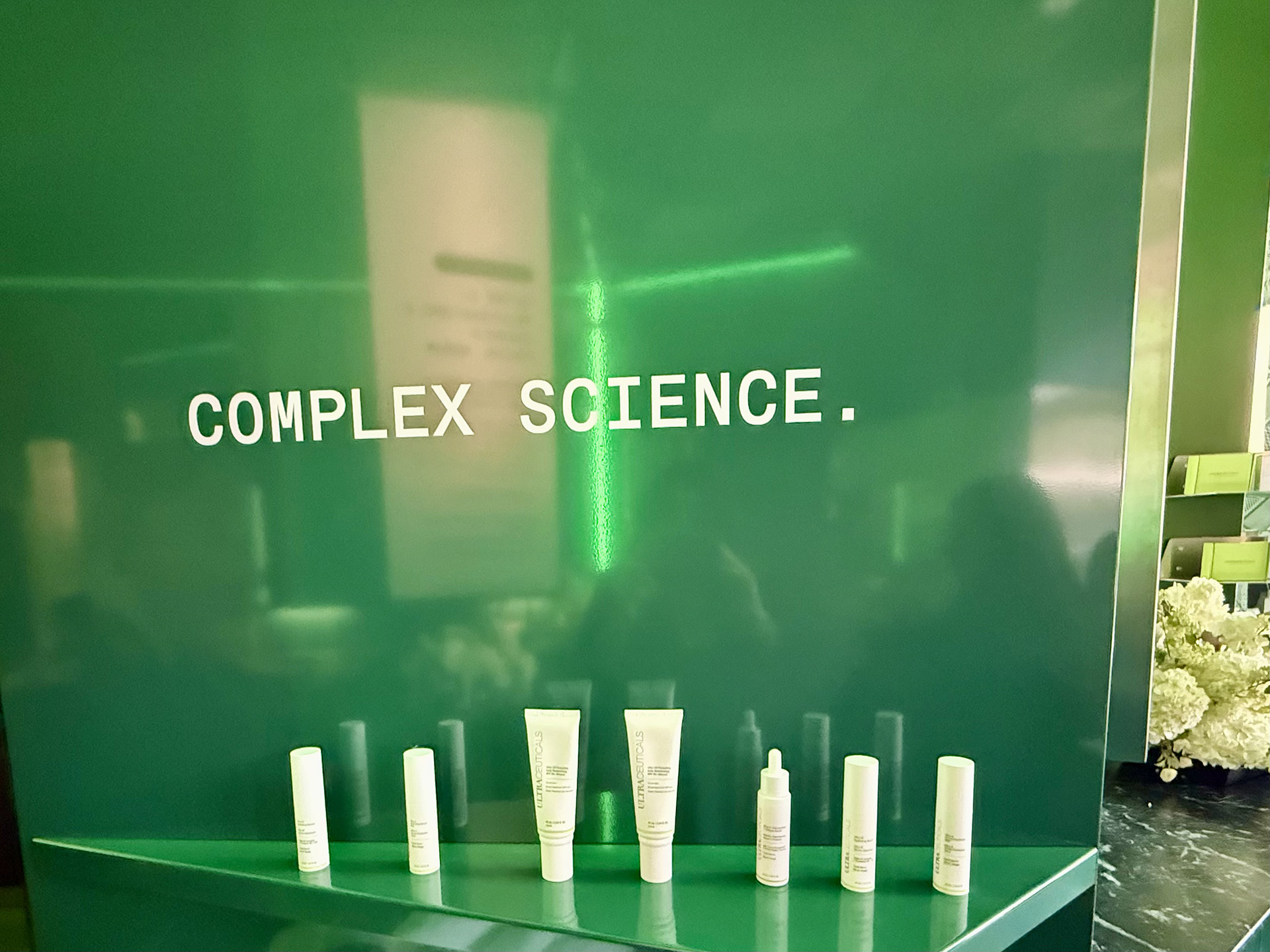 Complex Science sign alongside a collection of Ultraceuticals skincare products