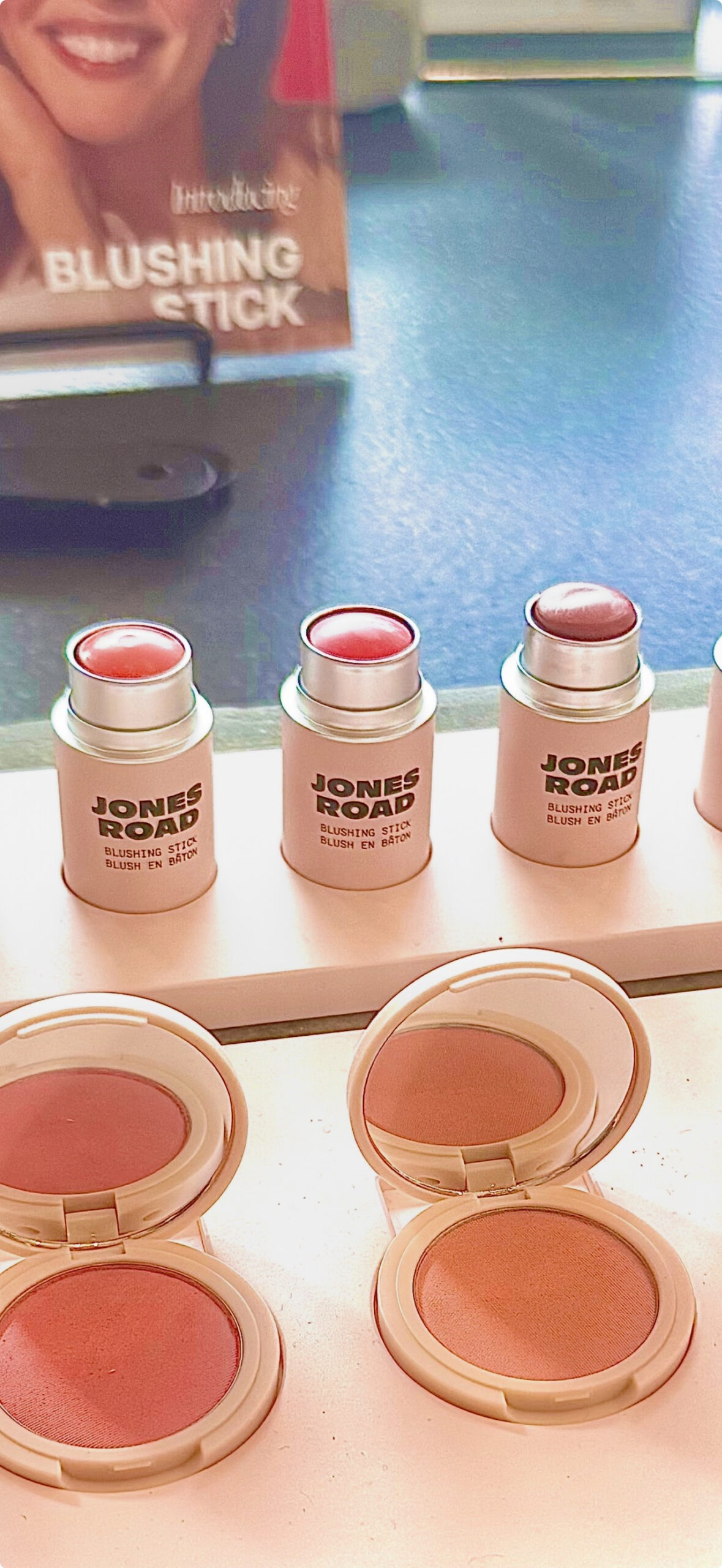 Closeup view of three Blushing Sticks with introducing Blushing Stick sign in background