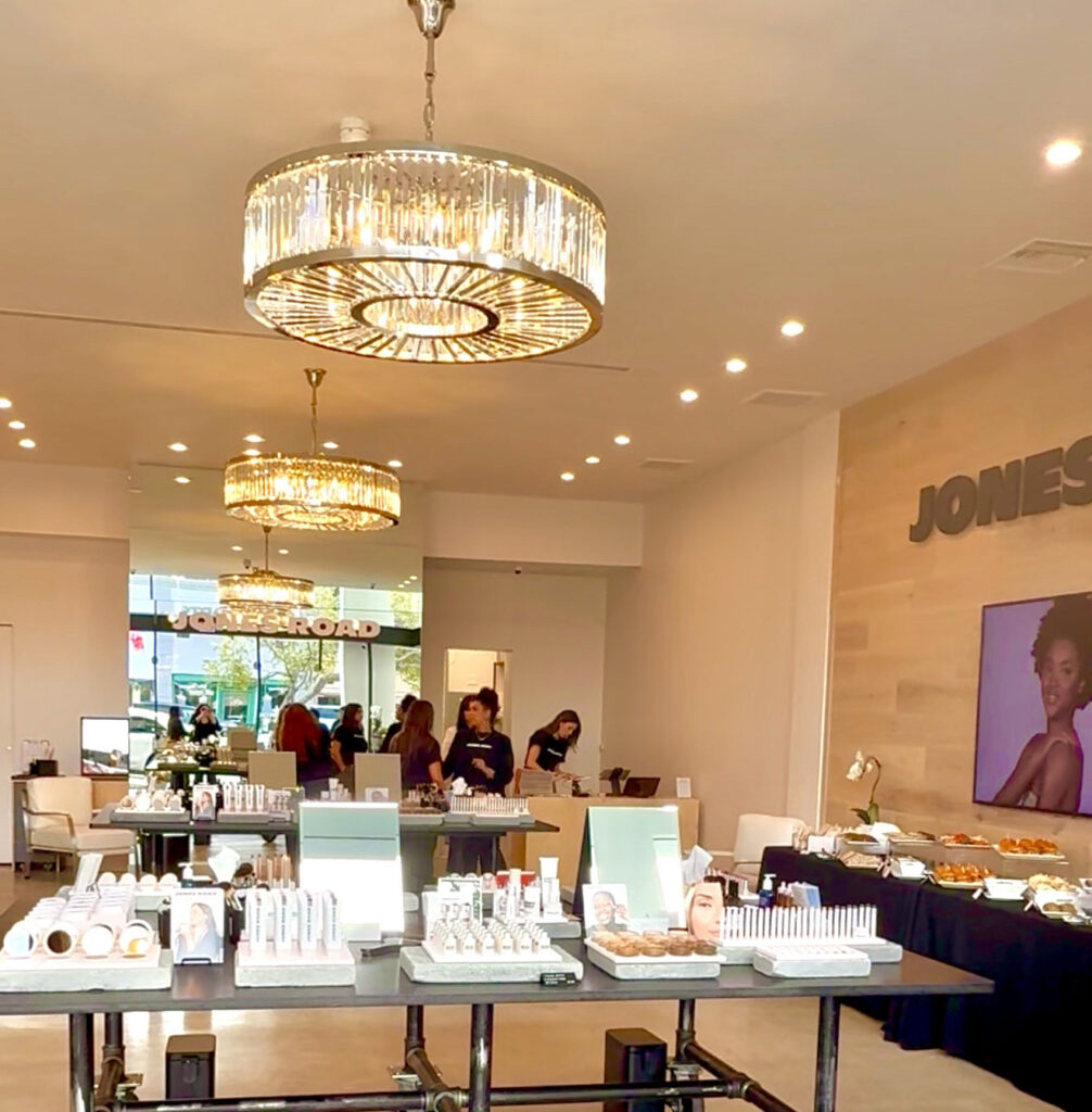 Two counters and staff getting ready for the opening of Jones Road Santa Monica