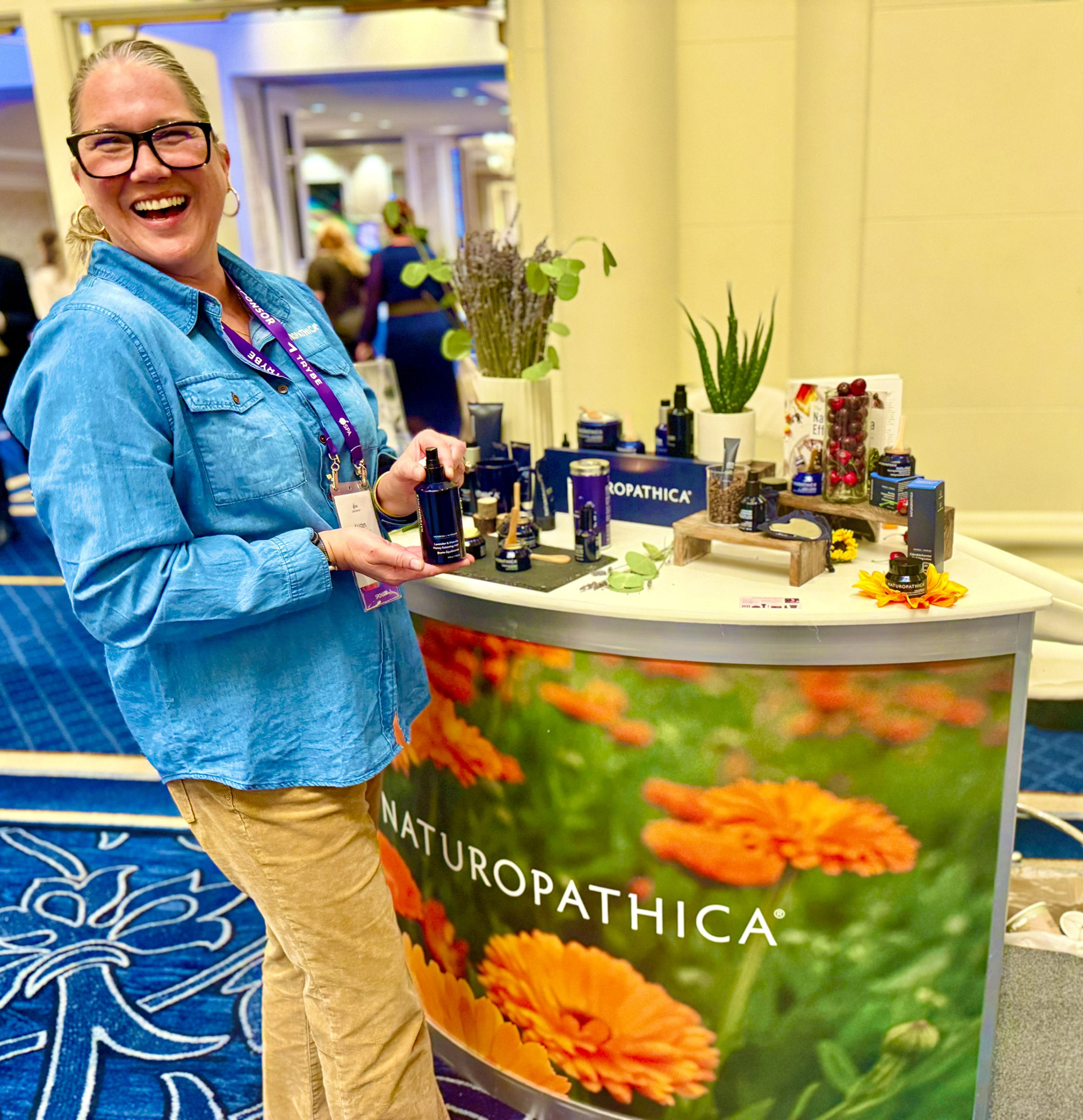 Naturopathica Woman working at the Naturopathica booth at the 2026 ISPA Conference