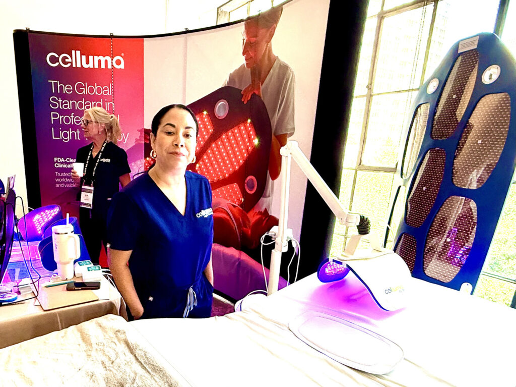 Two women at the Celluma The Global Standrd Professional Light booth at Live Love Spa LA 2025