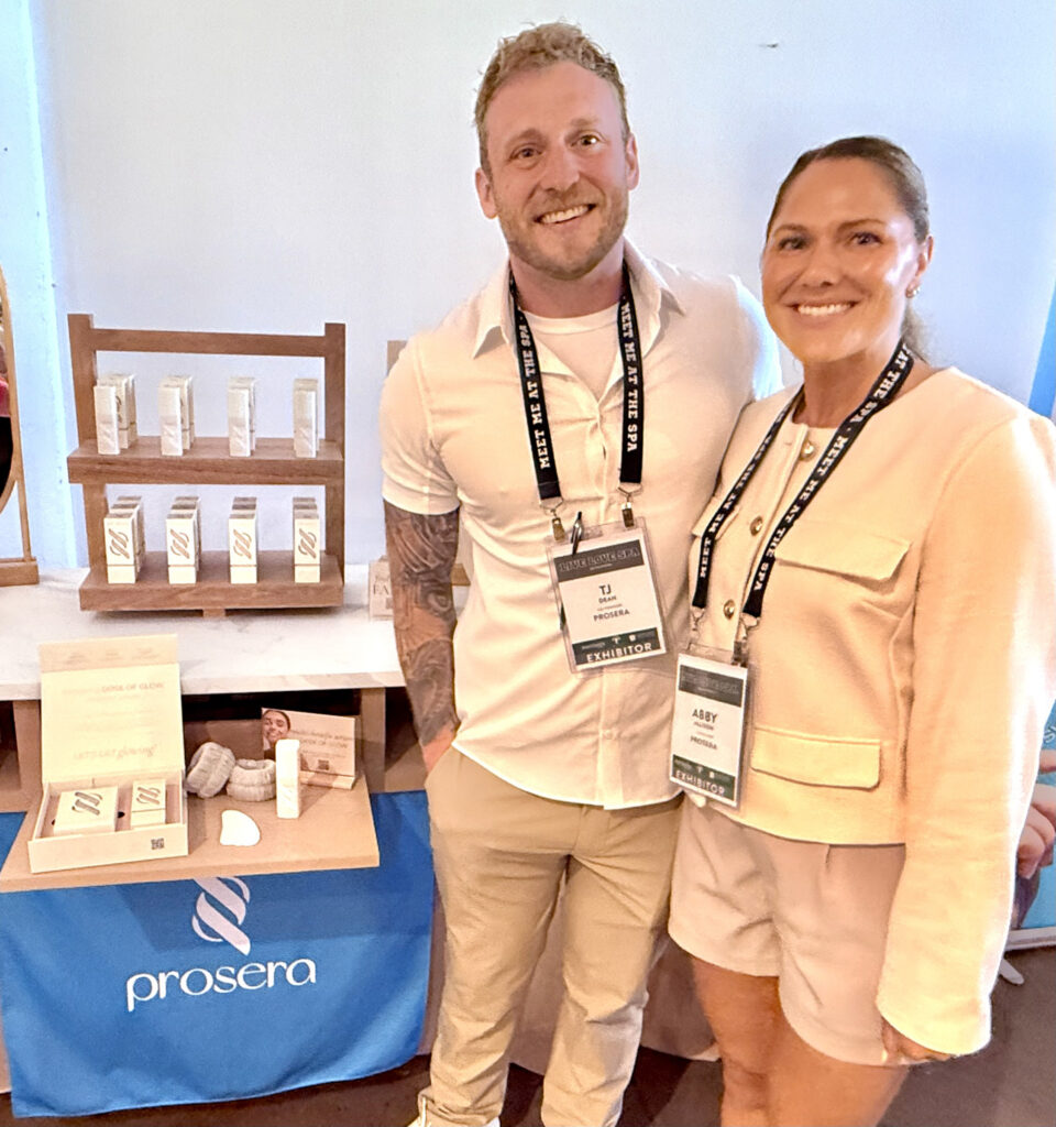 TJ and Abby from Prosera in front of their booth at Live Love Spa LA 2025