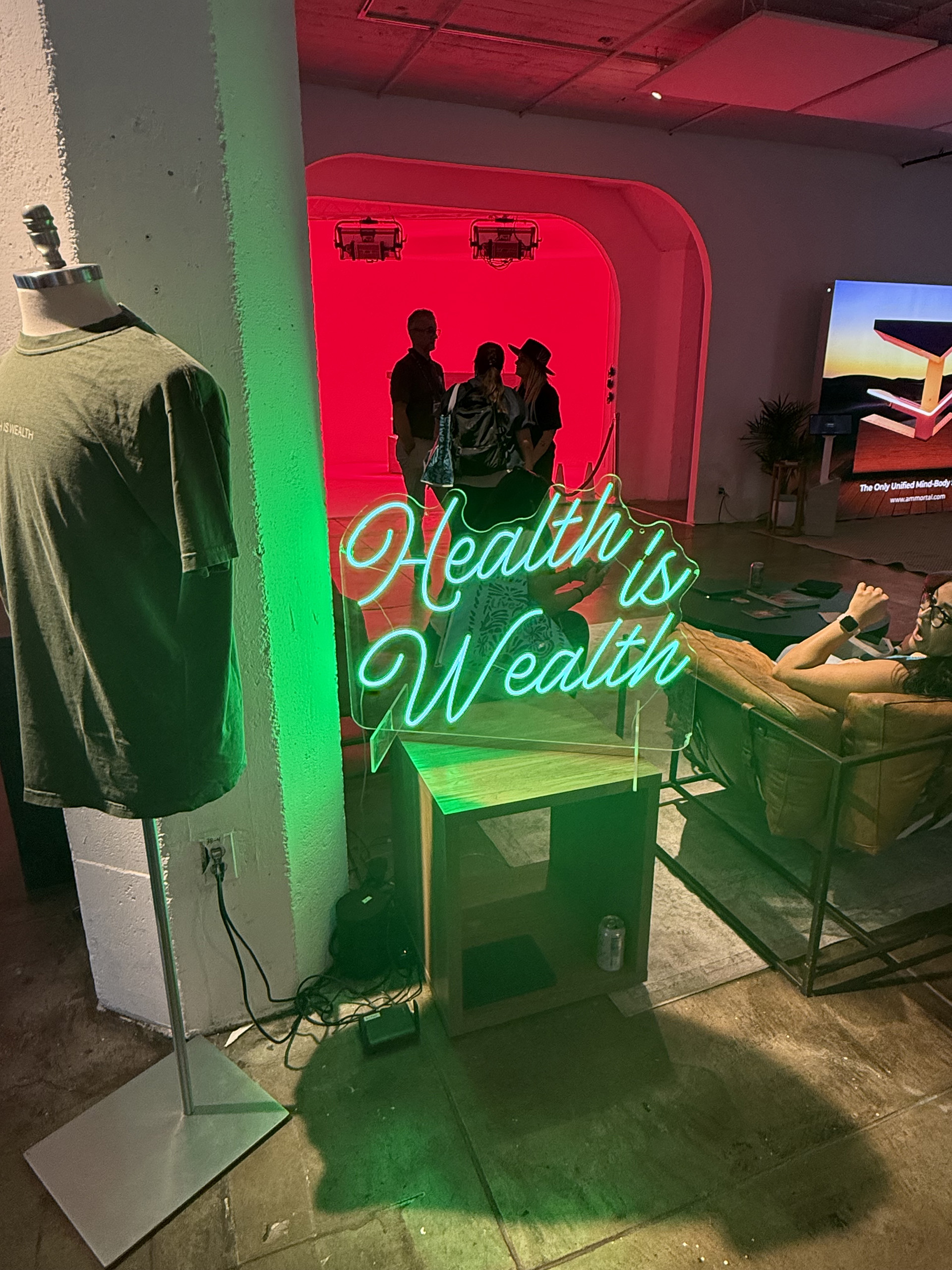 Health is Wealth neon sign Woman being frightened by the Health is Wealth neon sign at Live Love Spa