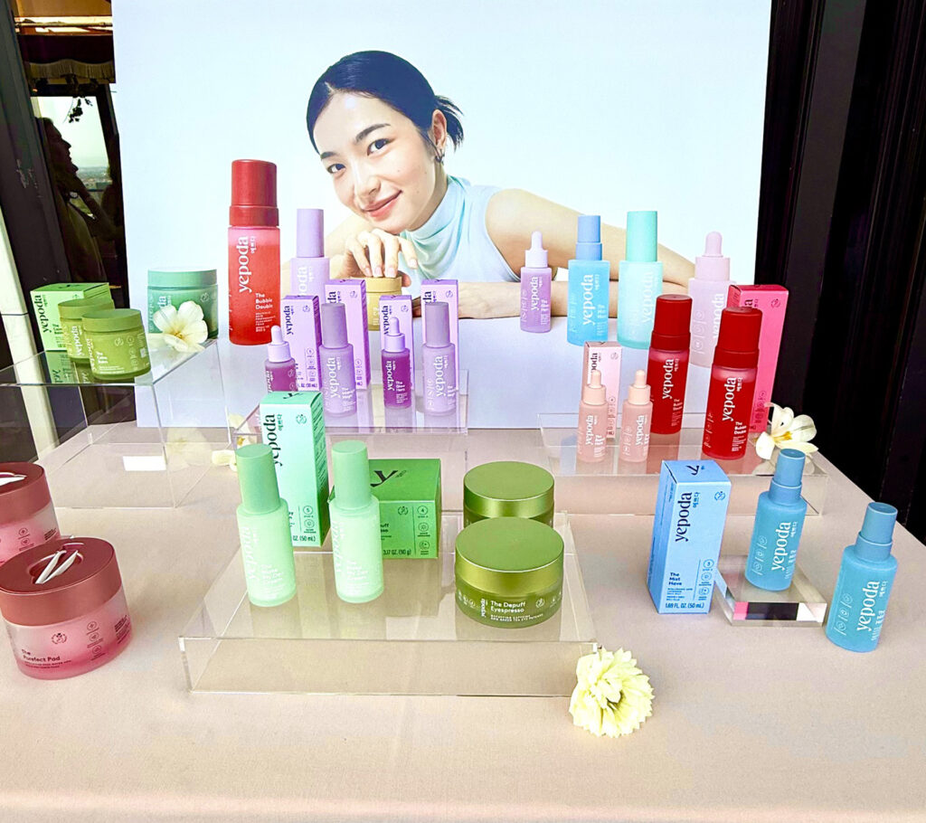 Display of Asian model with a variety of Yepoda skin care products